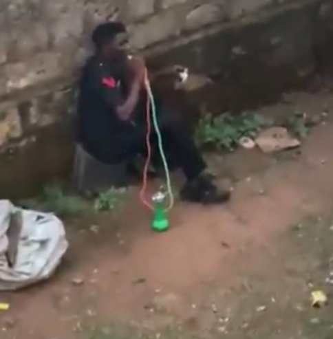 Policemen smoking shisha