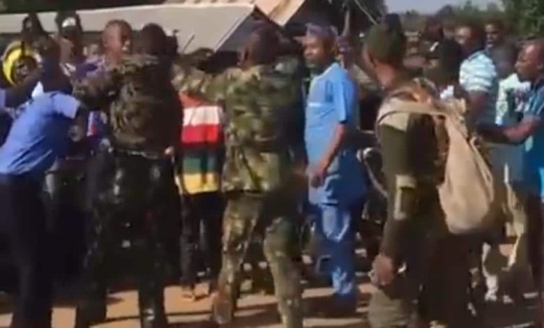 Tension As Gun-Wielding Policemen, Soldiers Publicly Engage In Serious Fight (VIDEO)