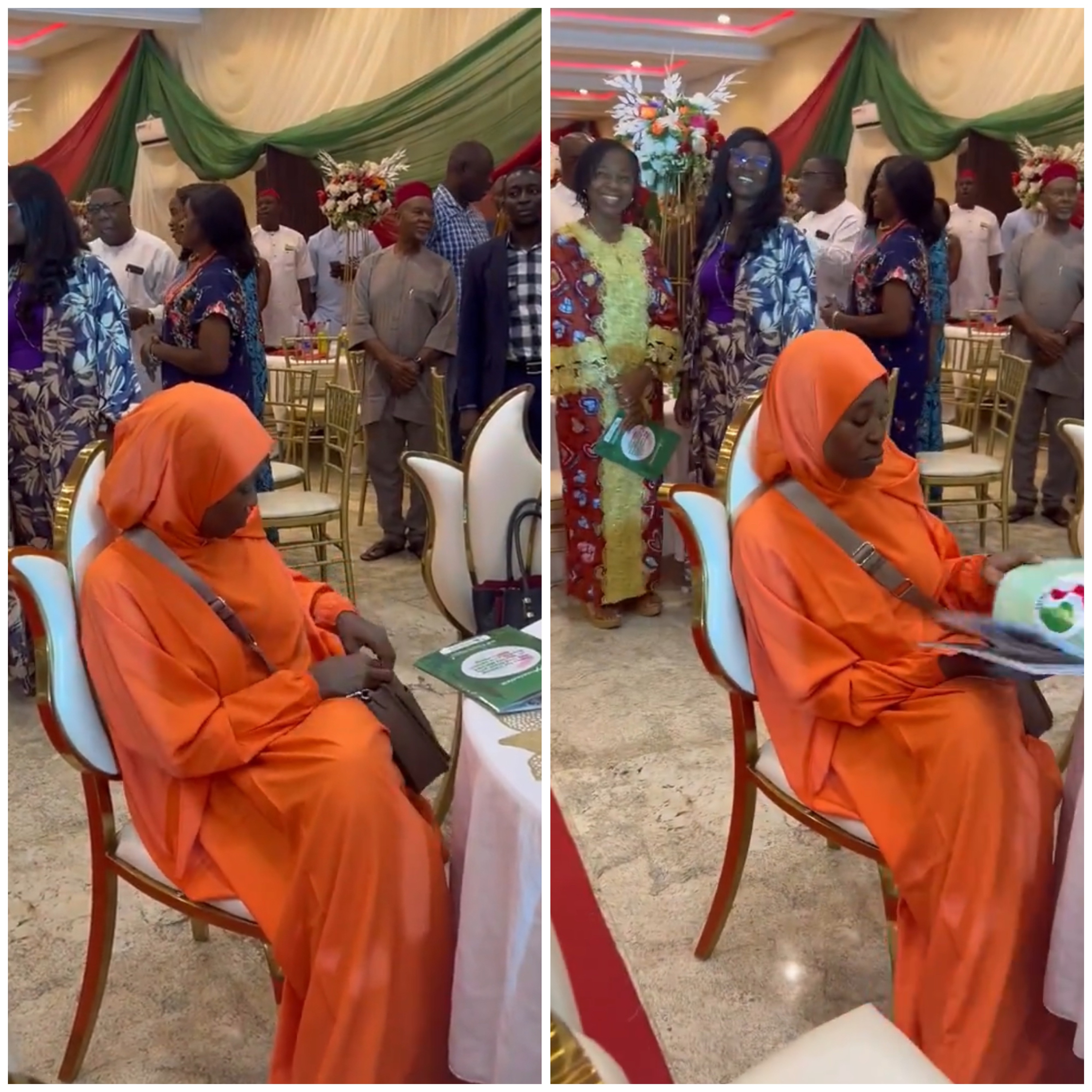 Activist, Aisha Yesufu, refuses to stand up during the recitation of the  new national anthem at an event (video)